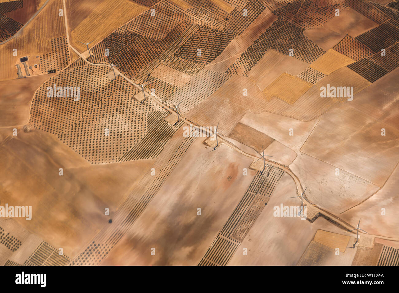 aerial of plantations and wind turbines on a plateau in Cyprus, Greece Stock Photo
