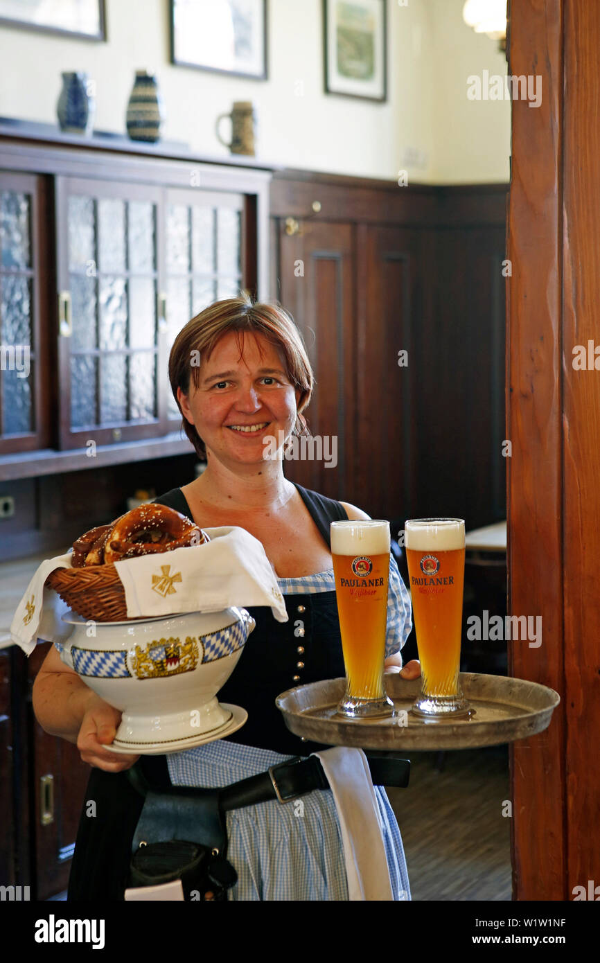 Waitress serving traditional white sausages and wheat beer in restaurant Grossmarkthalle, Sendling, Munich, Upper Bavaria, Bavaria, Germany Stock Photo
