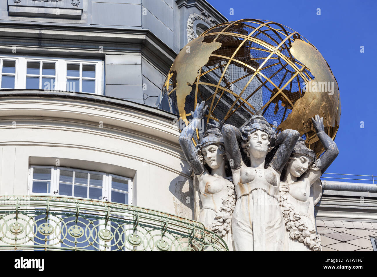 Sculpture with globe in front of palace Palais des Beaux Arts, Weißgerber district in Vienna, Eastern Austria, Austria, Europe Stock Photo