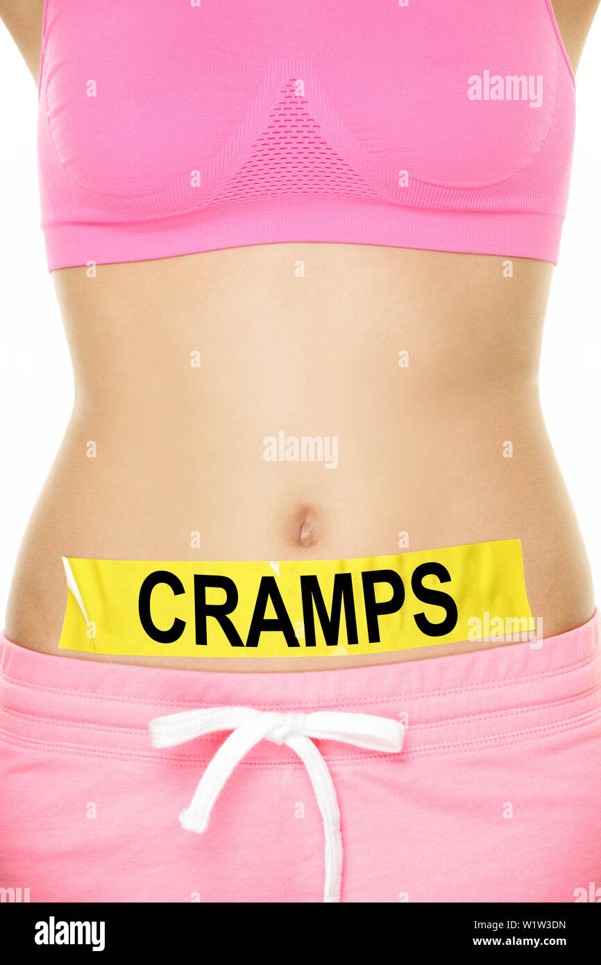Midsection of woman with cramps sign stuck on stomach. Young female is  representing stomach ache concept. Woman is wearing pink sports bra. She is  isolated over white background Stock Photo - Alamy