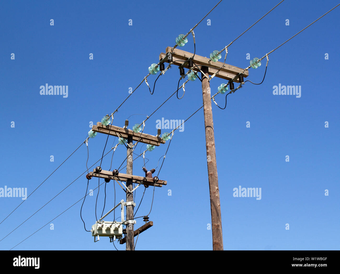 Overhead electricity cables in Troumpeta, Corfu, Greece Stock Photo - Alamy