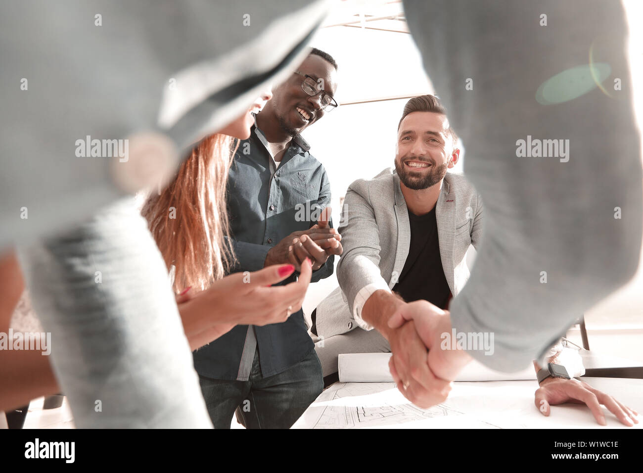 close up.architect and customer shaking hands Stock Photo