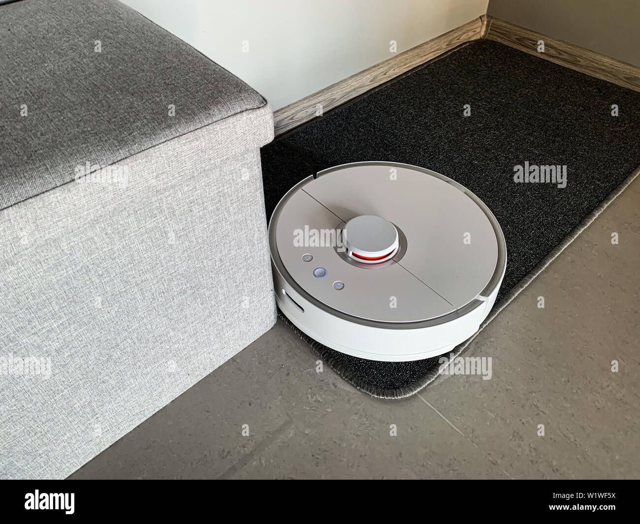 Smart House Vacuum Cleaner Robot Runs On Floor In A Living Room
