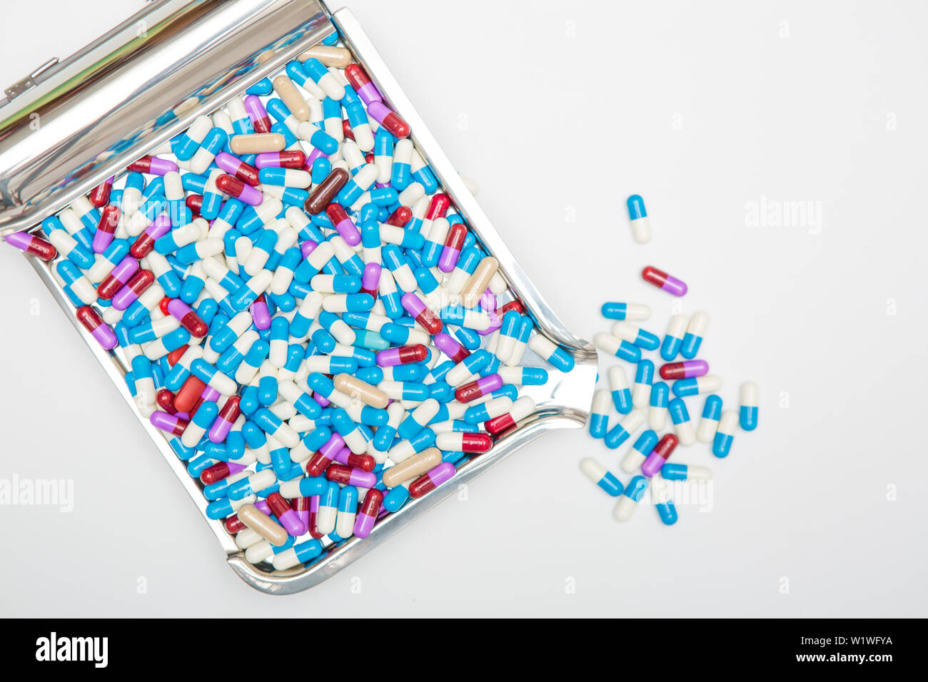 drug capsule on tray on white background Stock Photo - Alamy