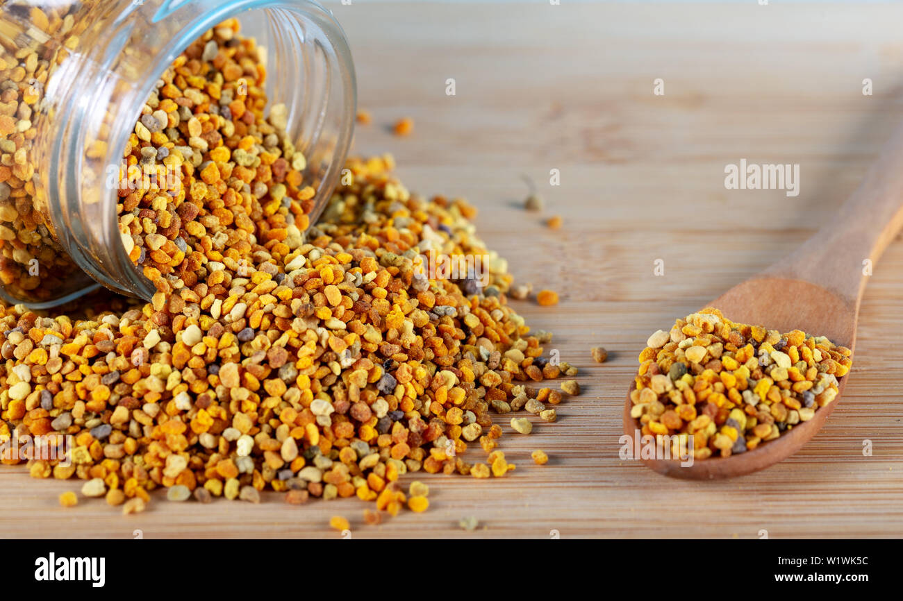 Bee pollen grains on a white background. Stock Photo