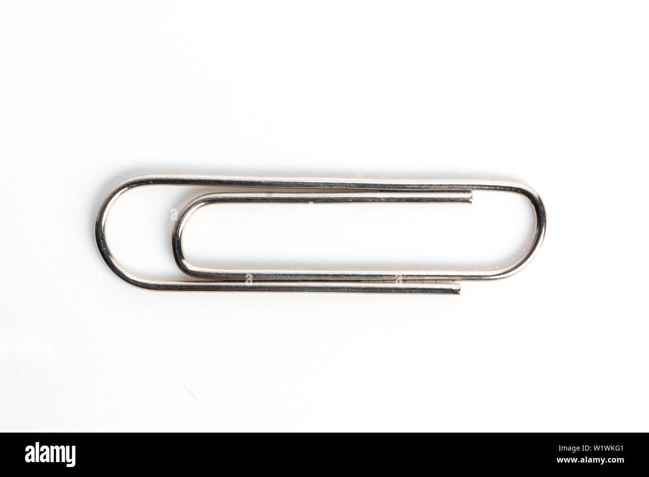 Metal paper clip on white background Stock Photo Alamy