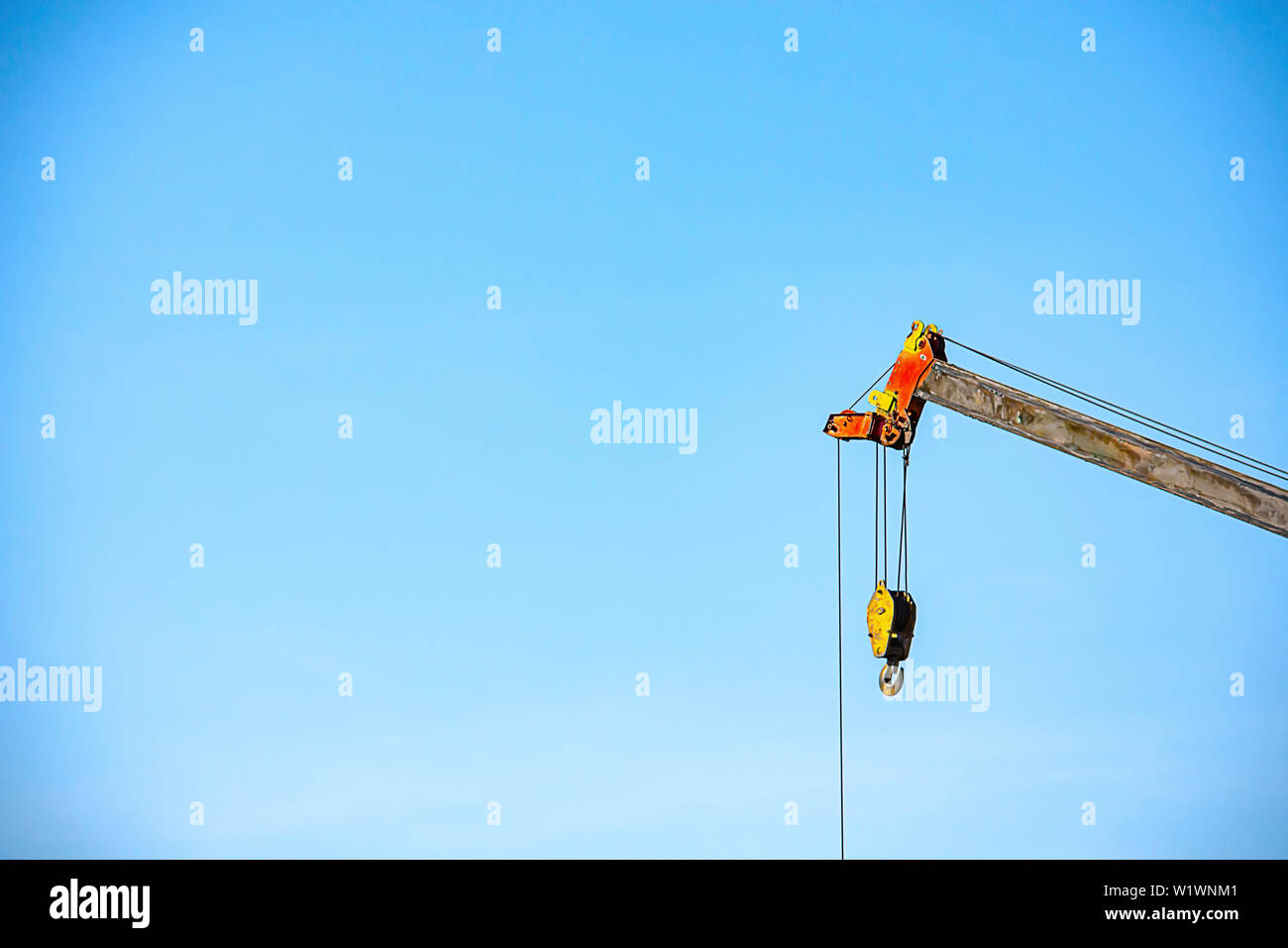 Sling and hoist the crane arm The background sky Stock Photo