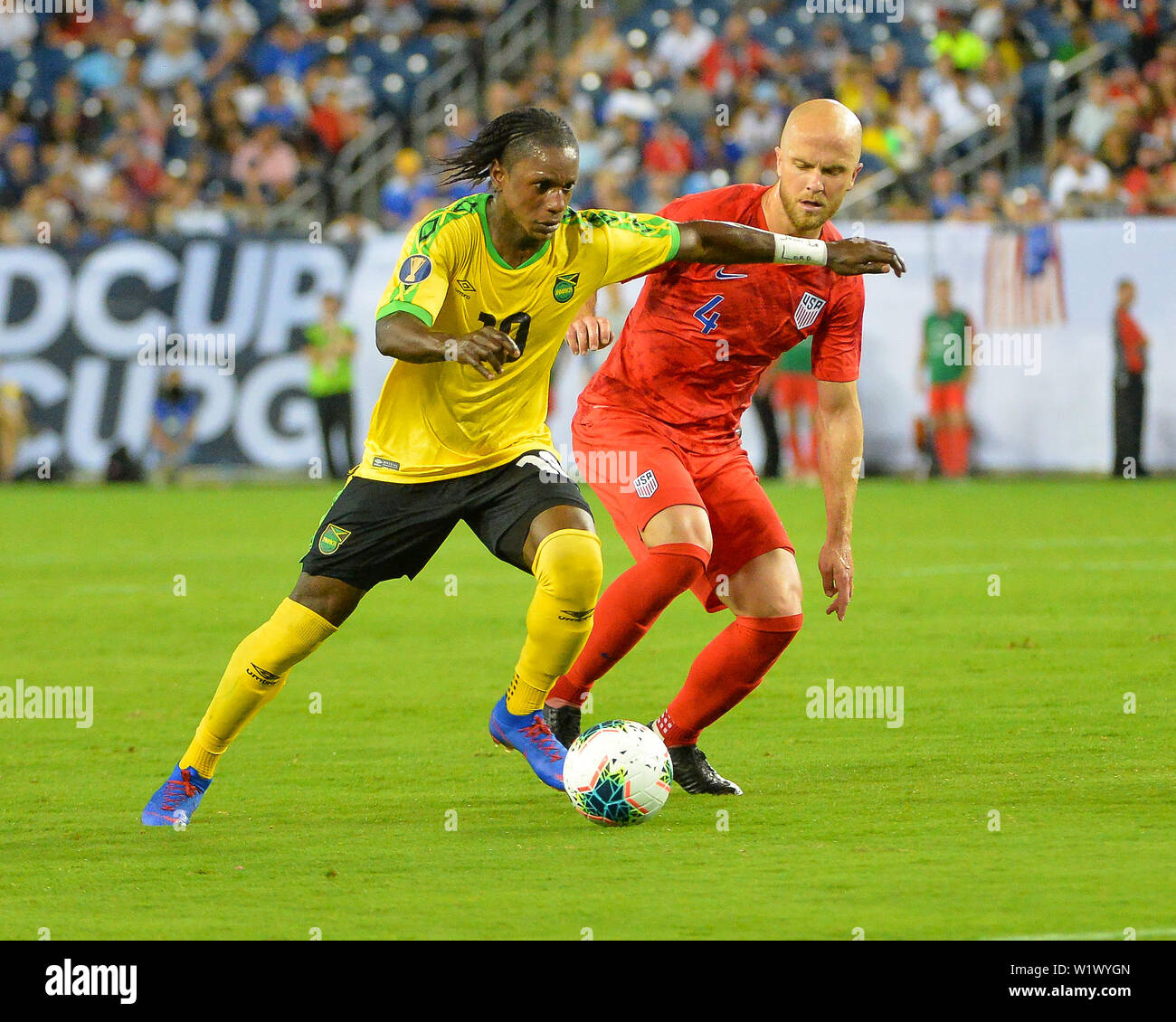 Nashville, TN, USA. 03rd July, 2019. Jamaica forward, Darren Mattocks (10), and US midfielder, Michael Bradley (4), work for ball control during the 2019 CONCACAF Gold Cup, semi final match between the United States and Jamaica, at Nissan Stadium in Nashville, TN. Mandatory Credit: Kevin Langley/Sports South Media/CSM/Alamy Live News Stock Photo