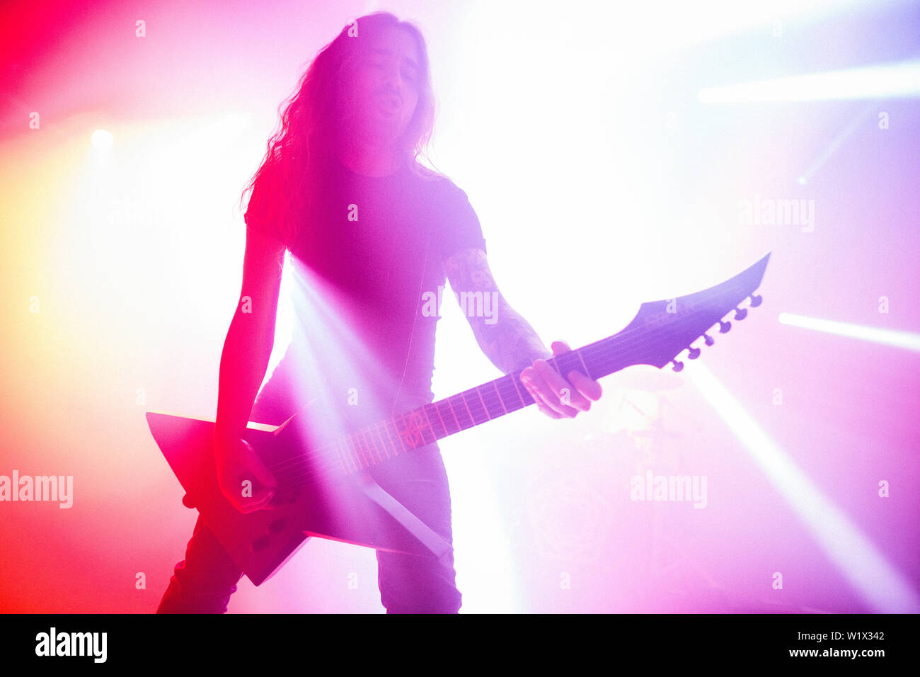 Roskilde, Denmark. 04th July, 2019. Roskilde, Denmark. July 04th, 2019. The French synthwave artist Carpenter Brut performs a live concert with his live band during the Danish music festival Roskilde Festival 2019. Here a live band member is seen on stage. (Photo Credit: Gonzales Photo/Alamy Live News Stock Photo