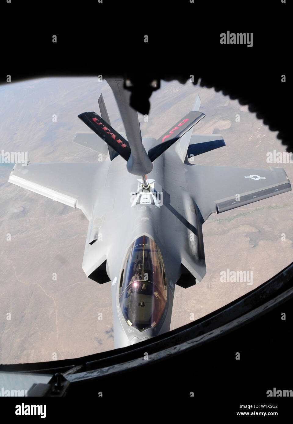 An F-35 Lightning II, assigned to Hill Air Force Base, Utah, prepares to be refueled by a Utah Air National Guard KC-135R Stratotanker during a refueling mission June 27, 2019 above the skies of Nev. Hill AFB and the Utah Air National Guard are regional partners that routinely participate in refueling missions. (U.S. Air National Guard photo by Staff Sgt. Danny Whitlock) Stock Photo