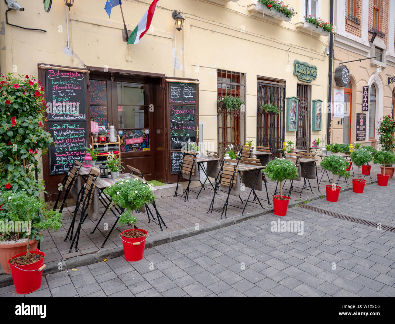 Gyor Hungary 05 07 2019 a cozy little pub terrace with flowers Stock Photo  - Alamy
