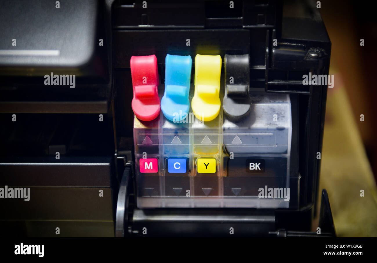 printer ink tank for refill at office / Close up printer cartridge inkjet  of color black CMYK , selective focus Stock Photo - Alamy