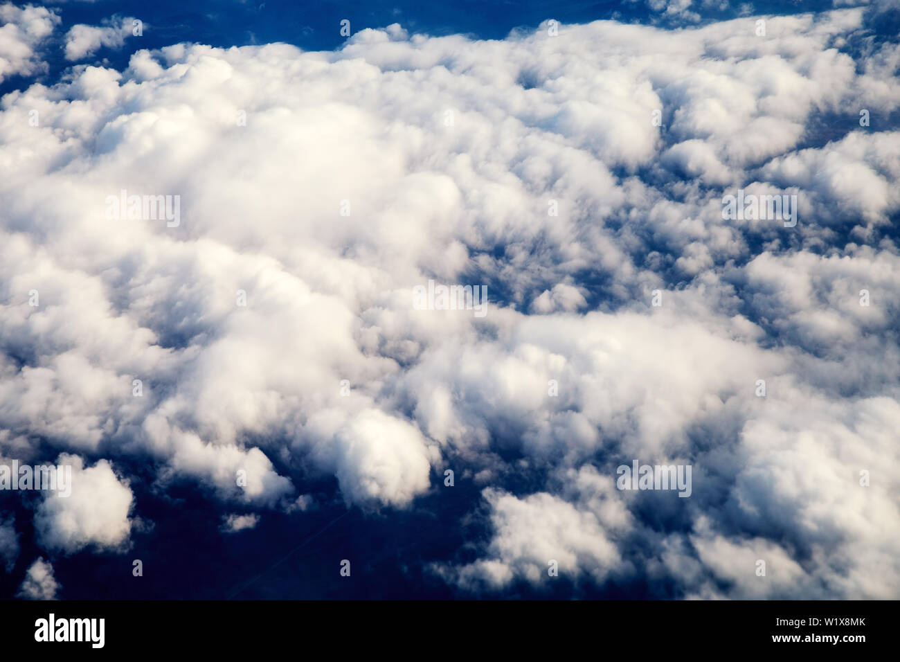 View of the beautiful sky and clouds from the window of the airplane ...