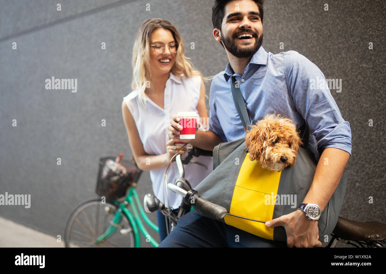 Couple in love with dog walking and smiling outdoor Stock Photo - Alamy
