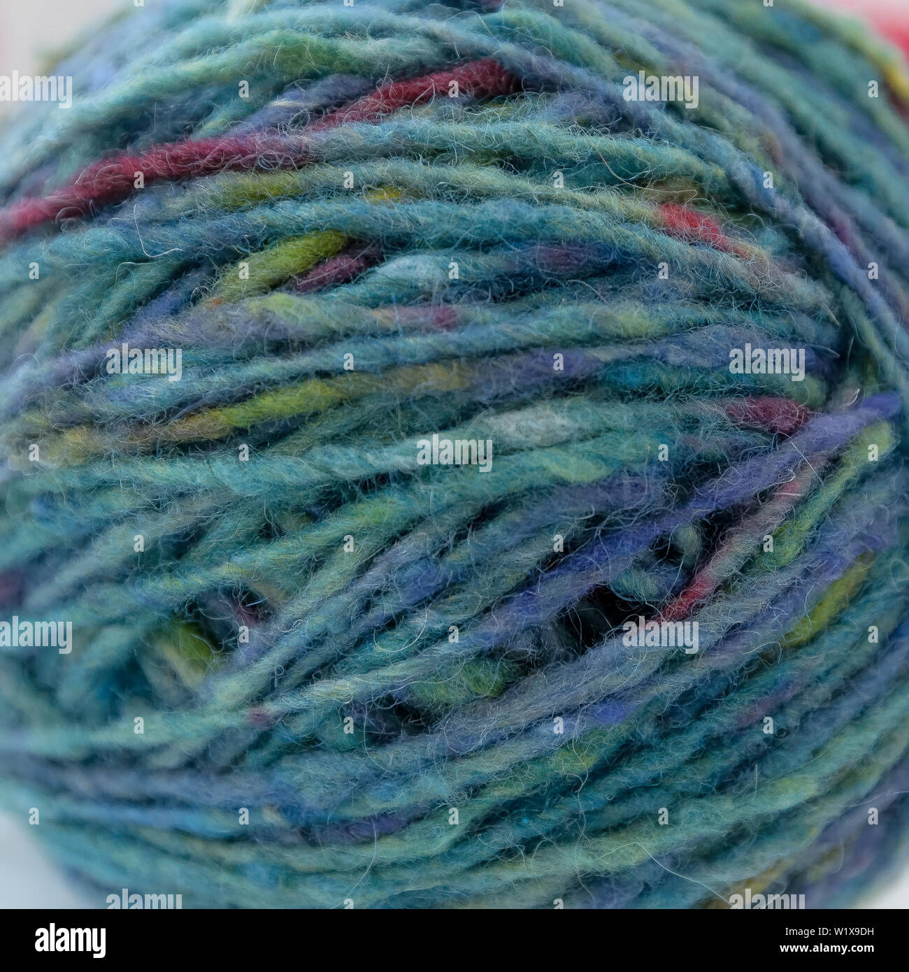 macro of multicolored wool yarn in ball Stock Photo