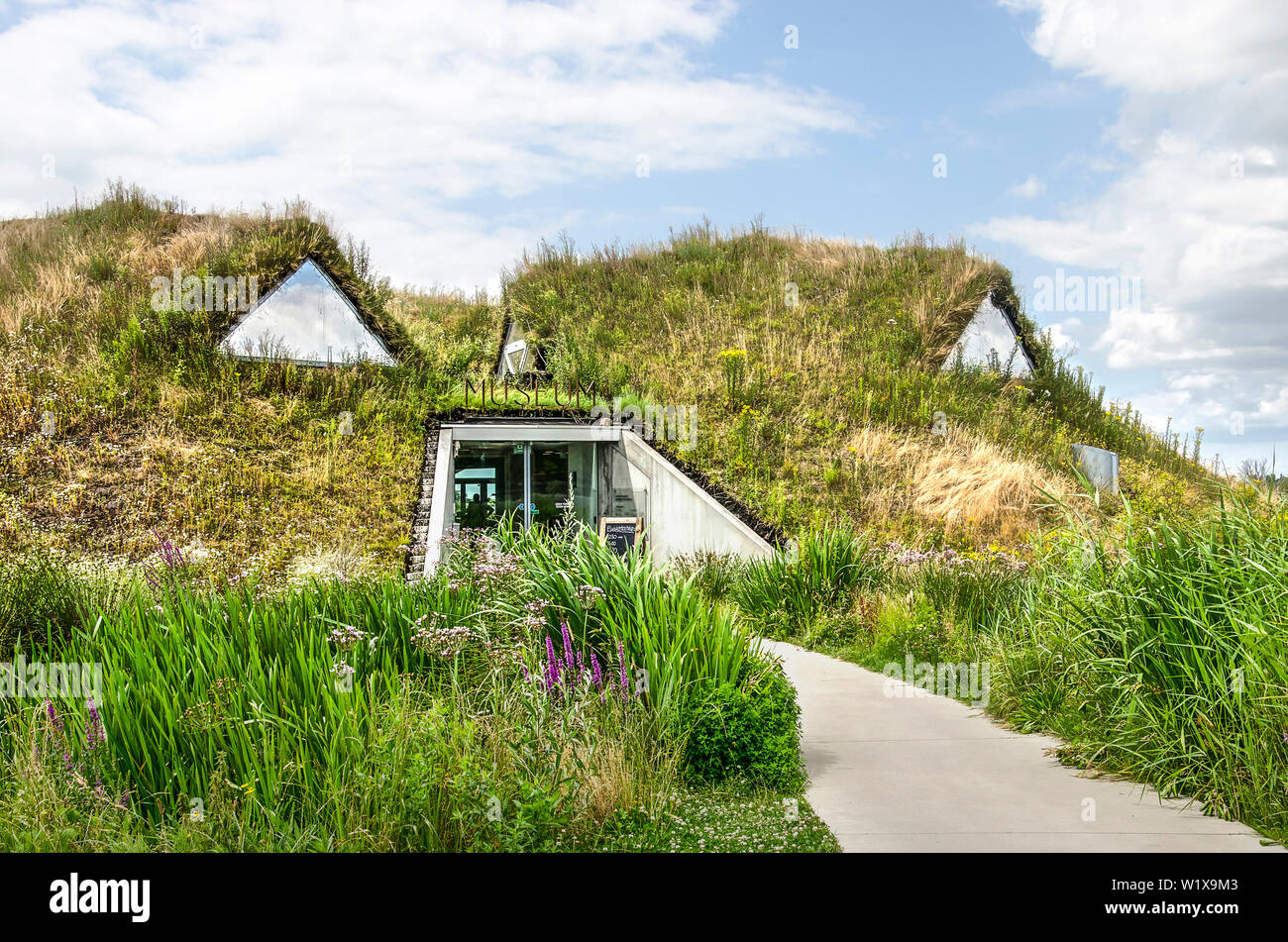 Werkendam, The Netherlands, July 3, 2019: entrance to the museum in Biesbosch national park, covered with soil, grass and wildflowers Stock Photo