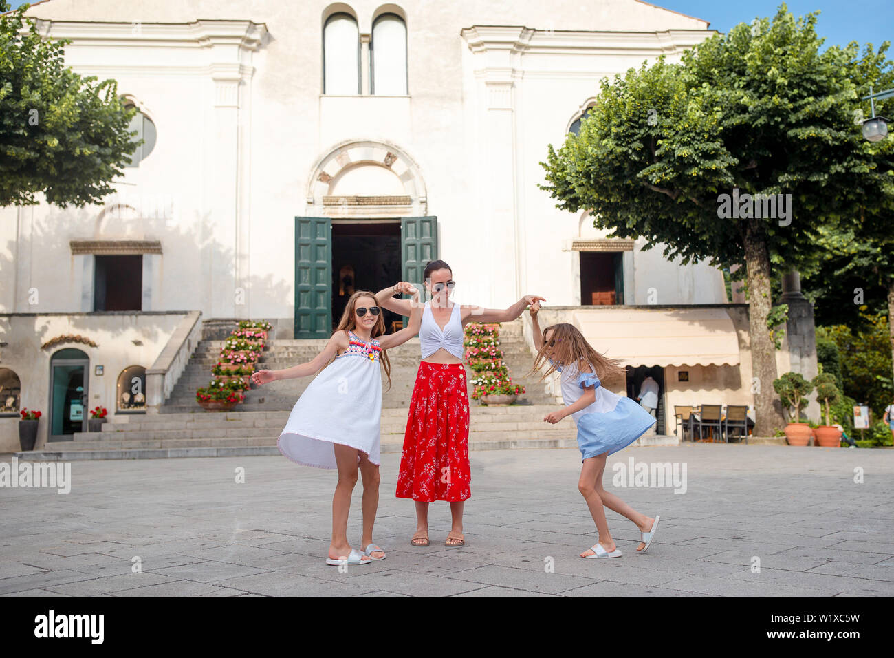 Adorable little girls and young mother have fun Stock Photo - Alamy