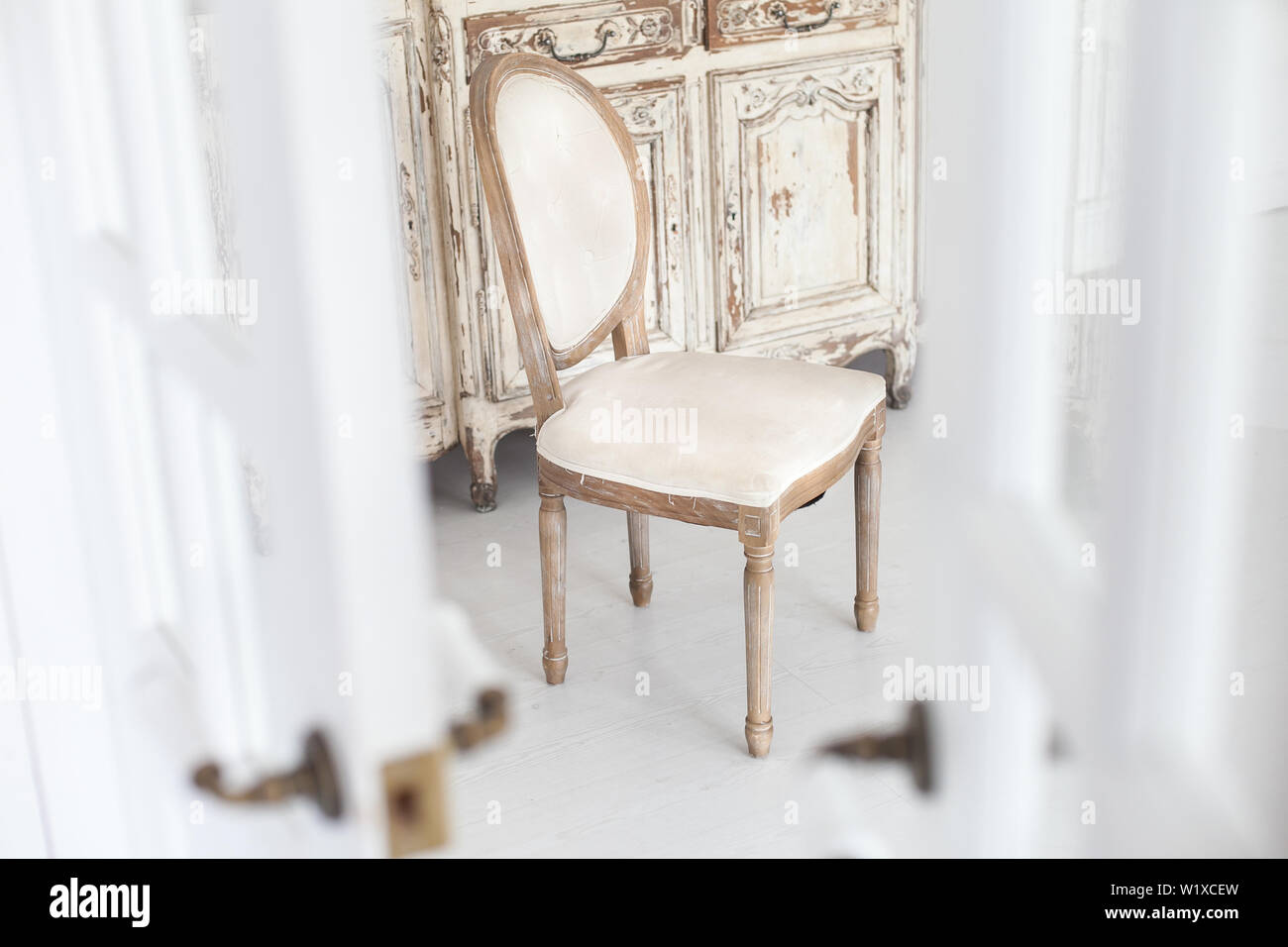 Vintage chair with textile upholstery in a luxurious interior. Soft focus. Stock Photo