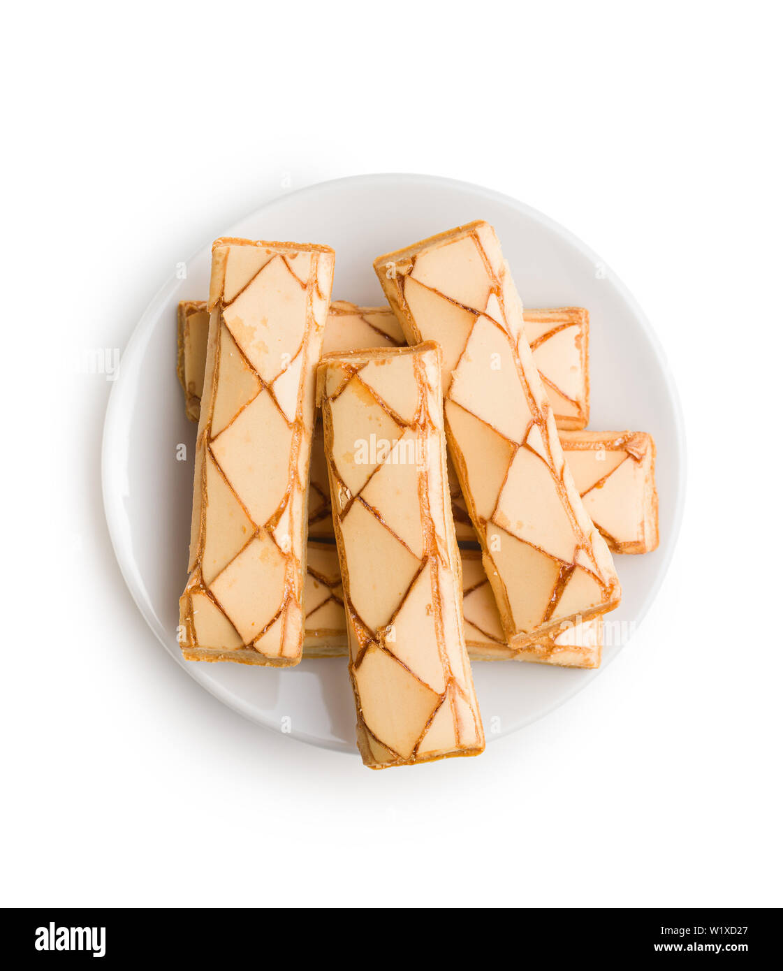 Sweet biscuits. Tasty dessert on plate isolated on white background. Stock Photo