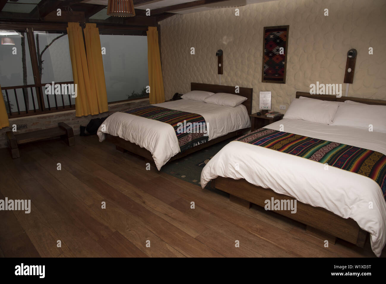 Comfortable guestroom at 2200 meters high Bellavista Lodge at the top of Tandayapa Valley in Ecuador.. Stock Photo