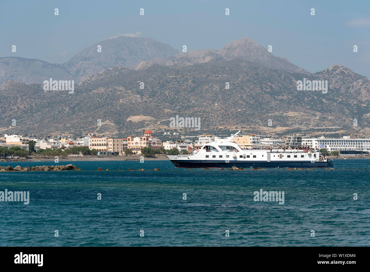 Ierapetra, Crete, Greece. June 2019. The Chrysi Express passenger ferry arriving in the port of Ierapetra from Chrissi Island Stock Photo