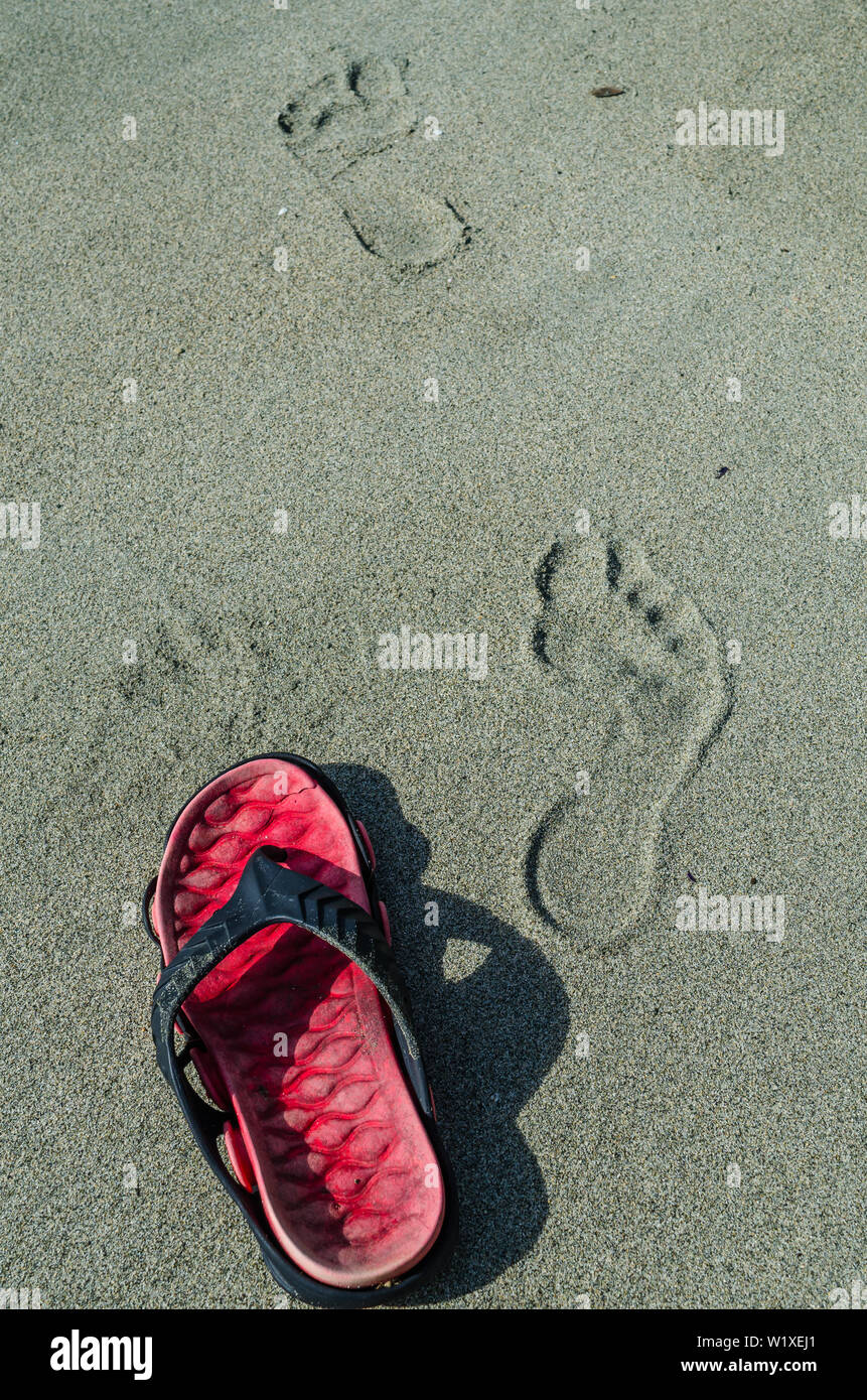 Foot steps on a beach Stock Photo - Alamy