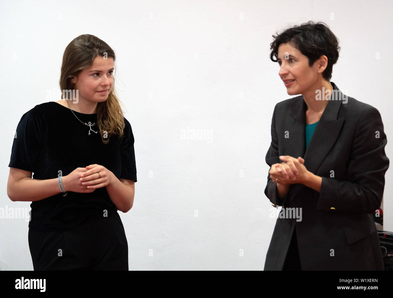 Berlin, Germany. 04th July, 2019. Anna-Lena von Hodenberg (r), Managing Director of HateAid gGmbh, and Luisa Neubauer, activist of Fridays for Future, talk before a press conference about the foundation of the organization HateAid. Society wants to help people who are confronted with insulting and discriminatory statements on the net. Credit: Soeren Stache/dpa/Alamy Live News Stock Photo