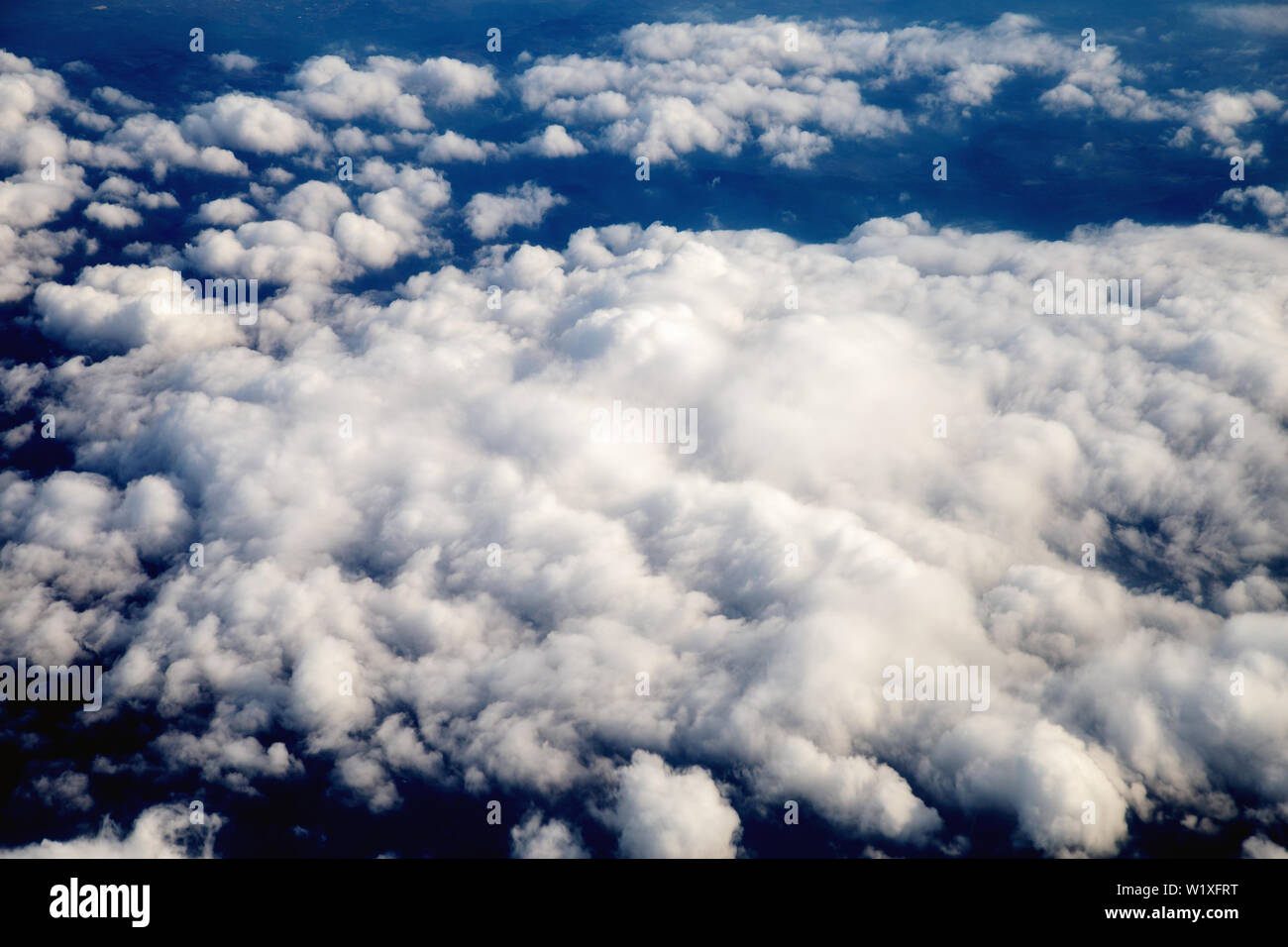 View of the beautiful sky and clouds from the window of the airplane ...