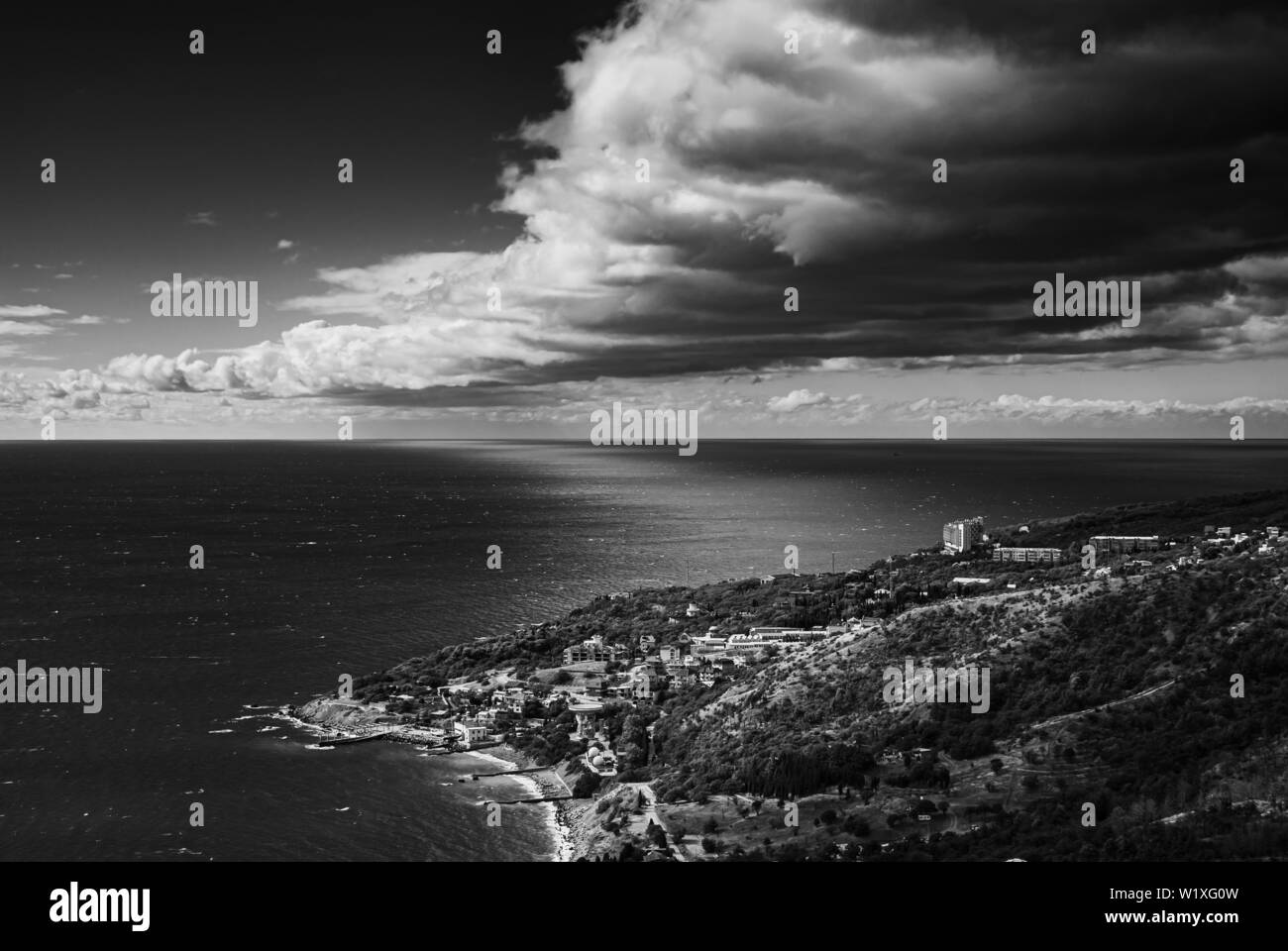 Black and white dramatic landscape with with Blue Bay at Black Sea shore near Katsiveli urban-type settlement, Crimean peninsula Stock Photo