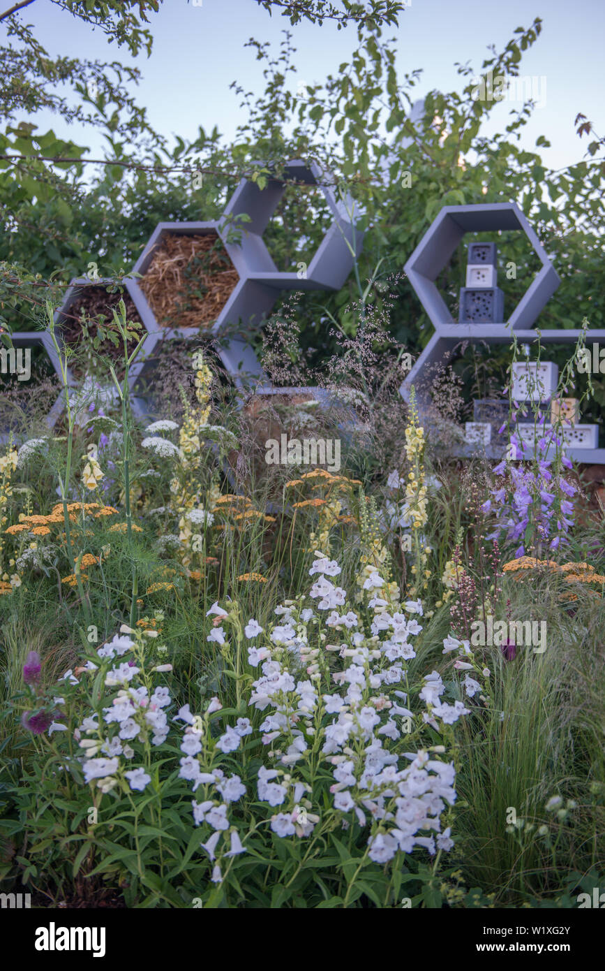 The Urban Pollinator Garden fuses design, function and wildlife-friendly values. It focuses on plants that encourage pollinators, specifically bees. Stock Photo