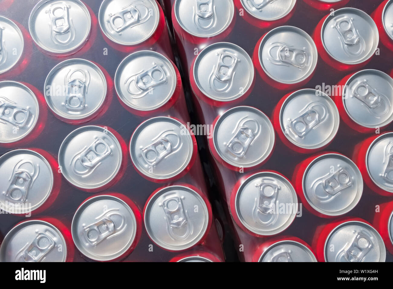 Red aluminium cans packed in plastick background Stock Photo