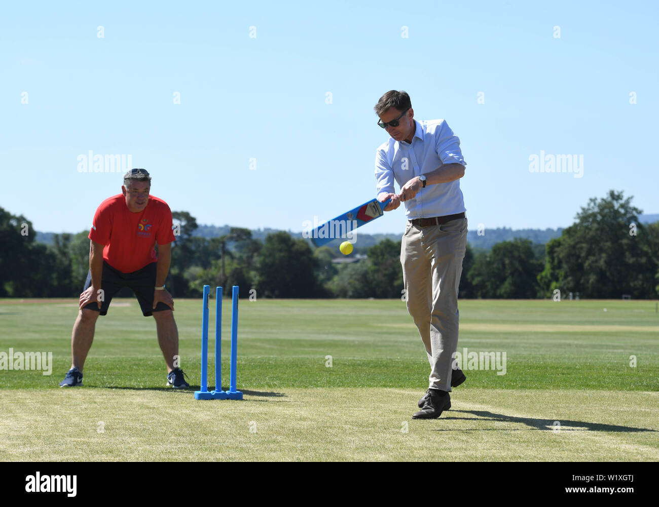 Conservative party leadership contender Jeremy Hunt tries his hand at cricket at the Surrey Para Games at the Charterhouse Club in Godalming. Stock Photo