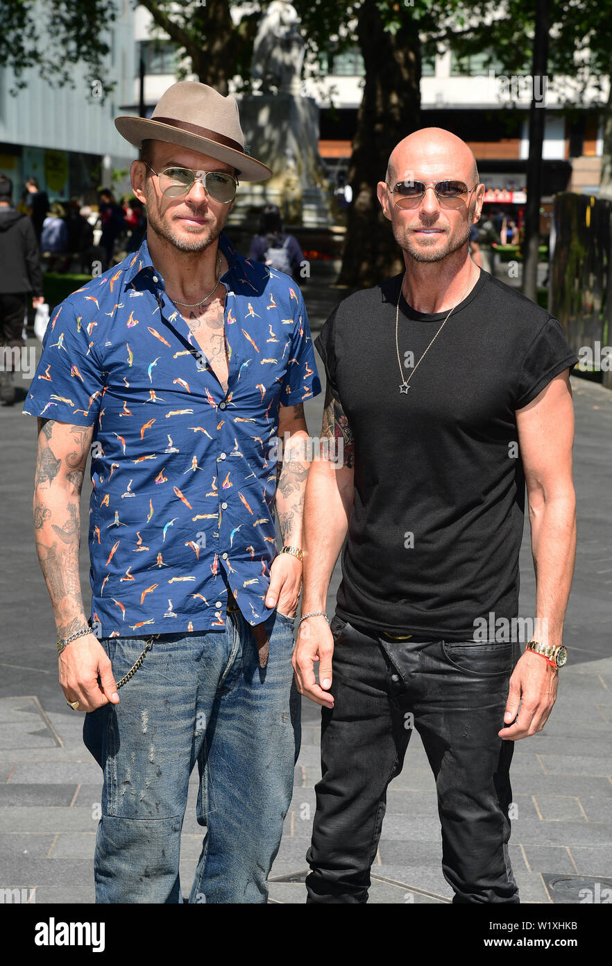Matt and Luke Goss arrive to appear on Global Radio, to promote their upcoming show A Night in with the Bros, which airs on BBC4 on July 19. Stock Photo