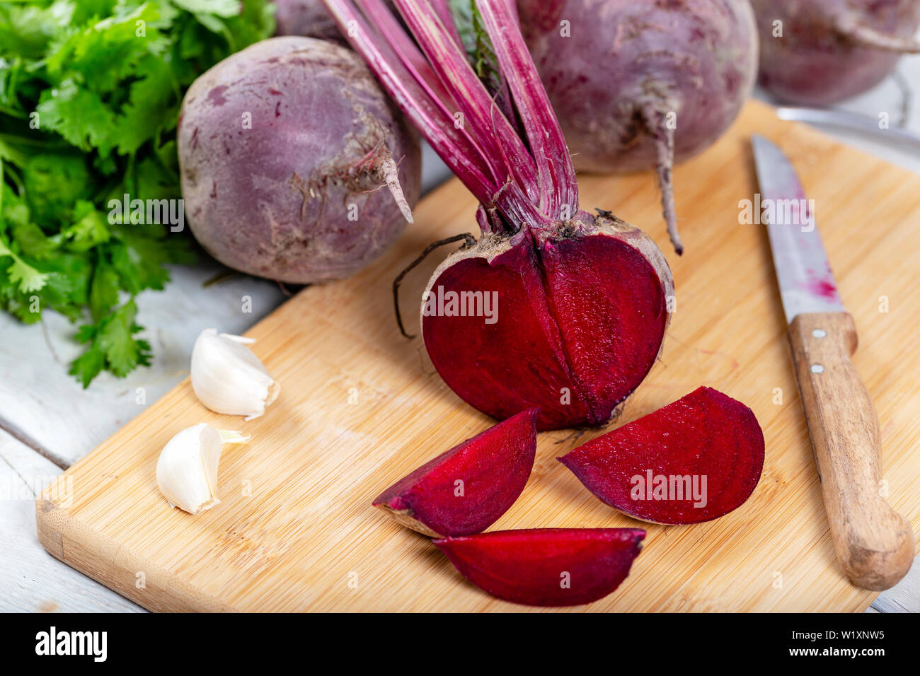 Red Beetroot with herbage green leaves on wooden background Stock Photo