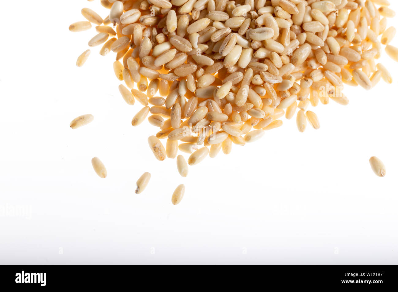 Pile of wheat grain isolated on white background Stock Photo - Alamy