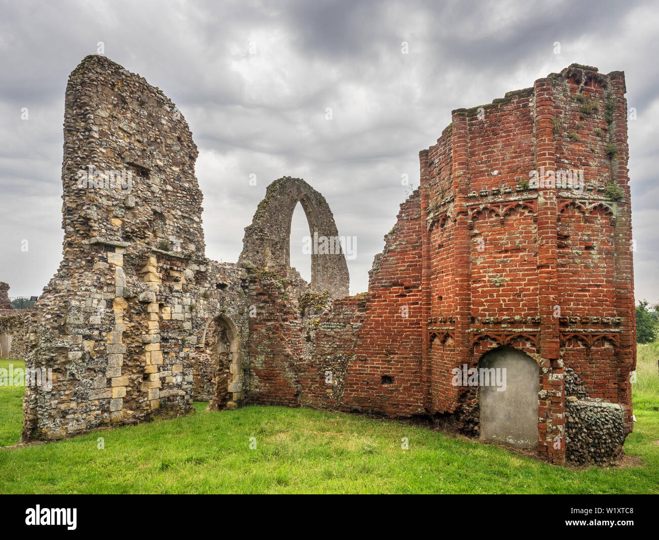 Rain clouds looming over the ruins of Leiston Abbey near Leiston Suffolk England Stock Photo