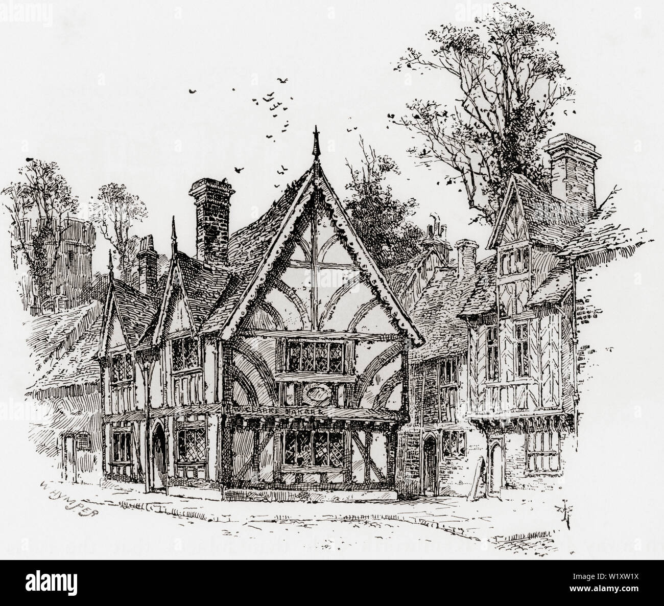 An old half- timbered house in Castle Street, Warwick, Warwickshire, England, seen here in the 19th century.  From English Pictures, published 1890. Stock Photo