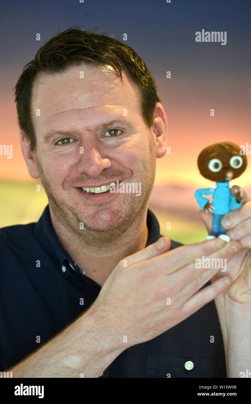 Writer Neil James with character 'Strike' from the 2018 stop motion movie Strike. Stock Photo