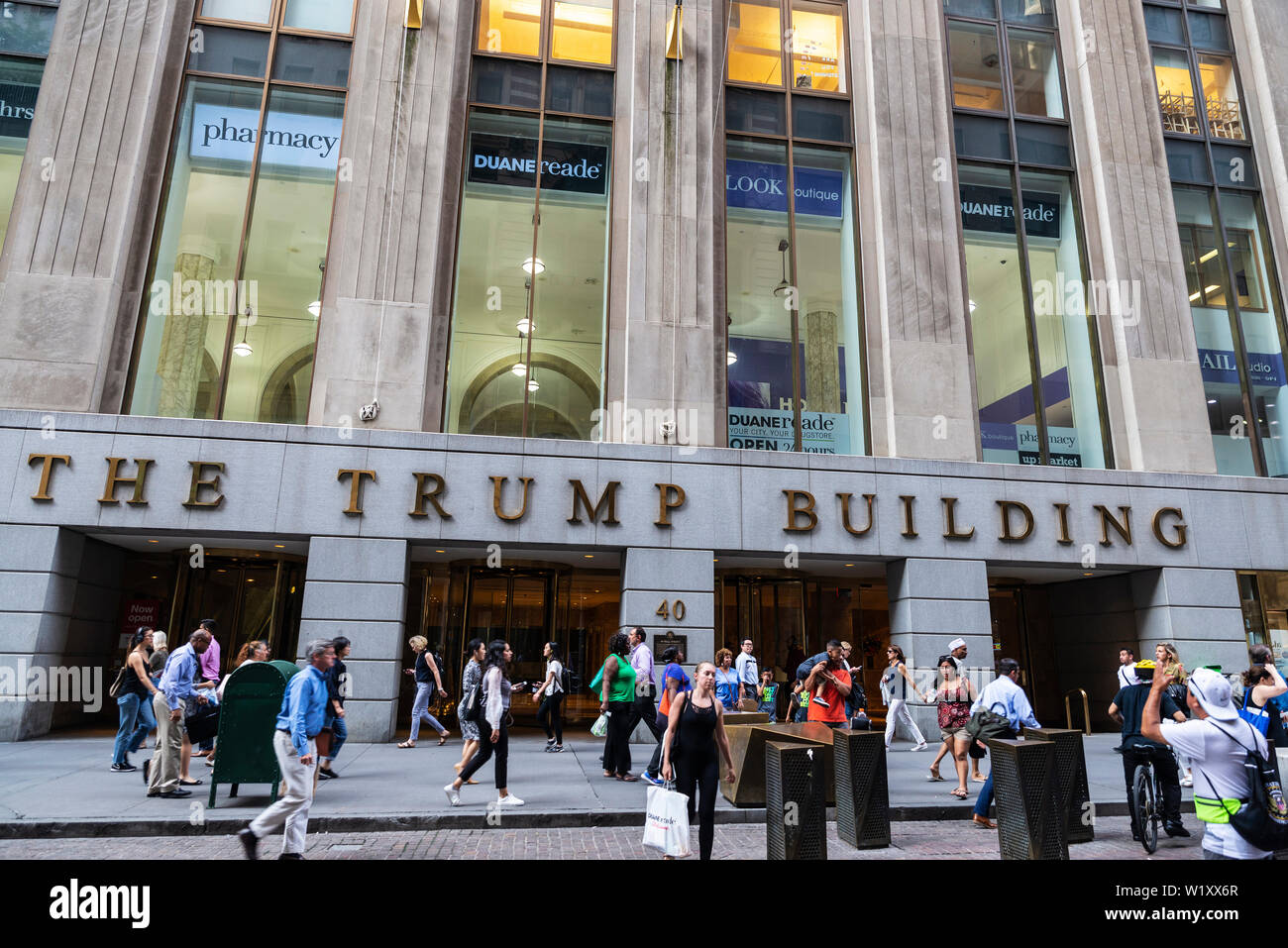 New York City, USA - August 1, 2018: Facade of The Trump Building on 40 Wall Street with people around in Manhattan, New York City, USA Stock Photo