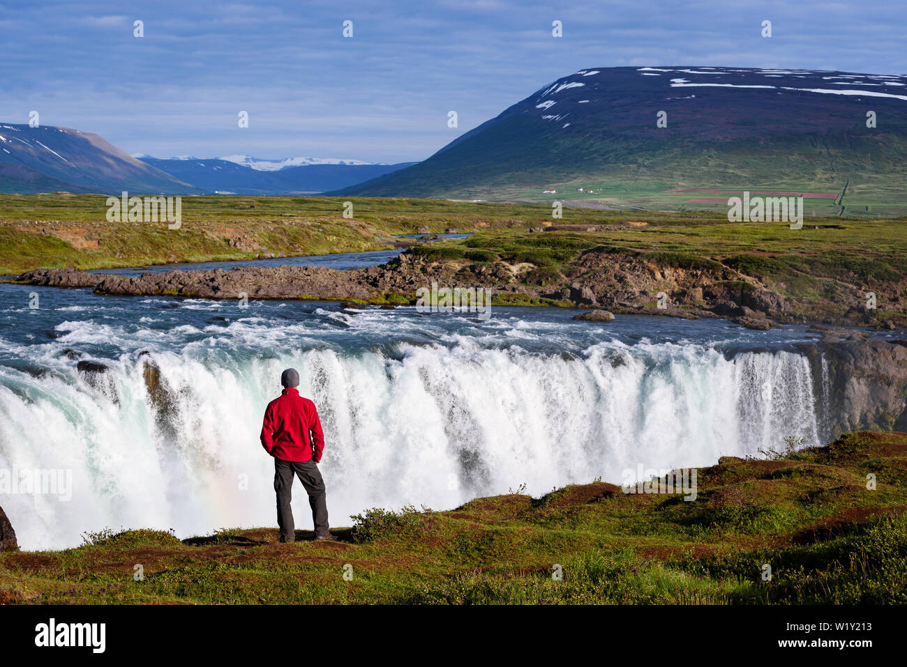A tourist in a red jacket sightseeing 