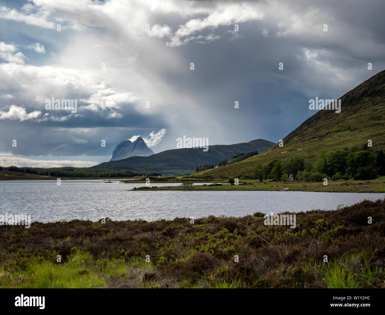 Suilven (731m), a mountain in the remote Scottish area of western Sutherland, is seen across Loch Borralan Stock Photo