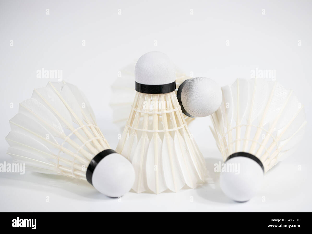 white badminton shuttlecocks lay on white table background Stock Photo