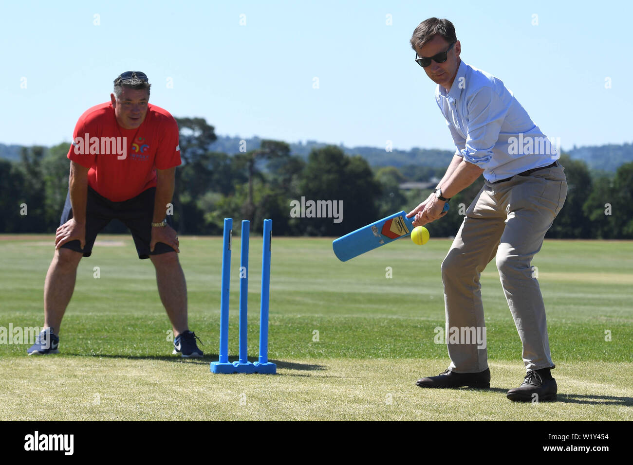 Conservative party leadership contender Jeremy Hunt tries his hand at cricket at the Surrey Para Games at the Charterhouse Club in Godalming. Stock Photo