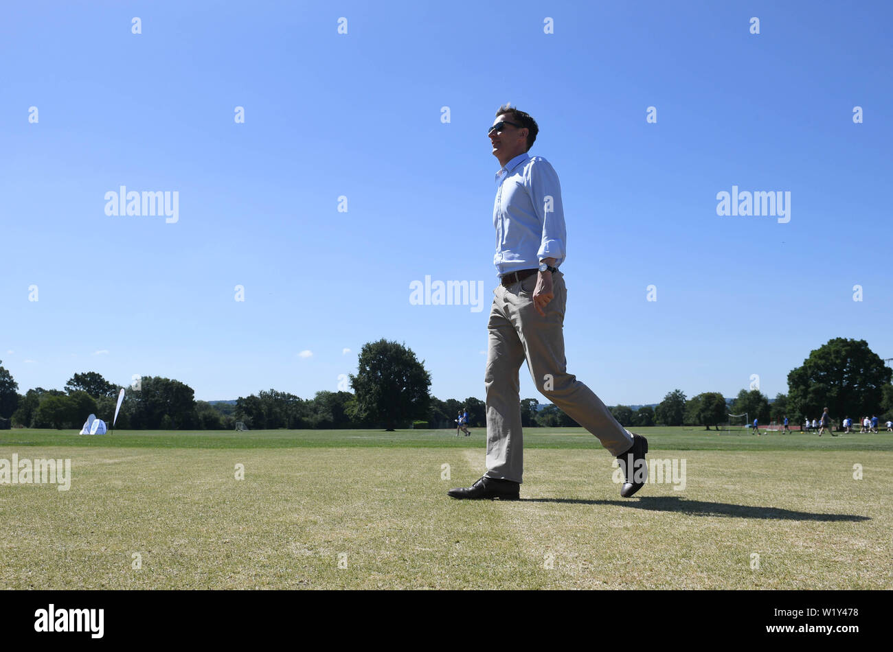 Conservative party leadership contender Jeremy Hunt walks out to try his hand at cricket at the Surrey Para Games at the Charterhouse Club in Godalming. Stock Photo