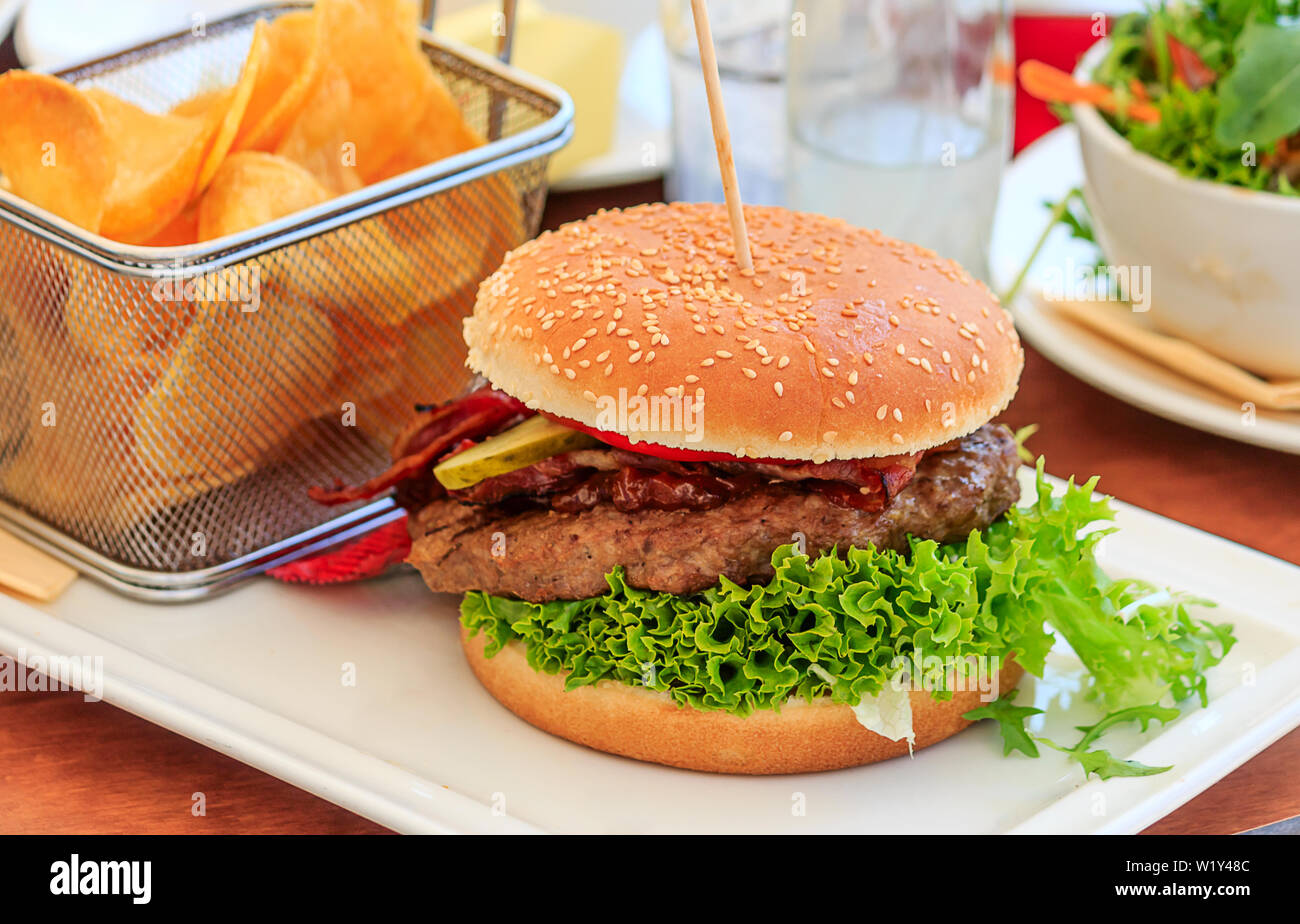 Tasty Burger with Chips Stock Photo
