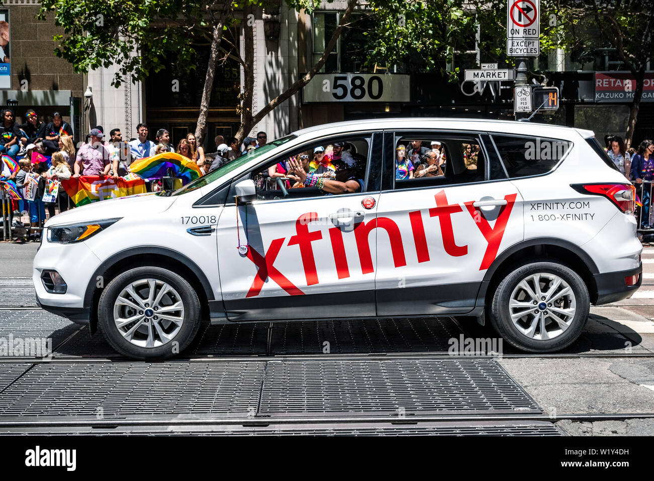 June 30, 2019 San Francisco / CA / USA - Xfinity branded vehicle taking art at the SF Pride Parade in downtown San Francisco Stock Photo