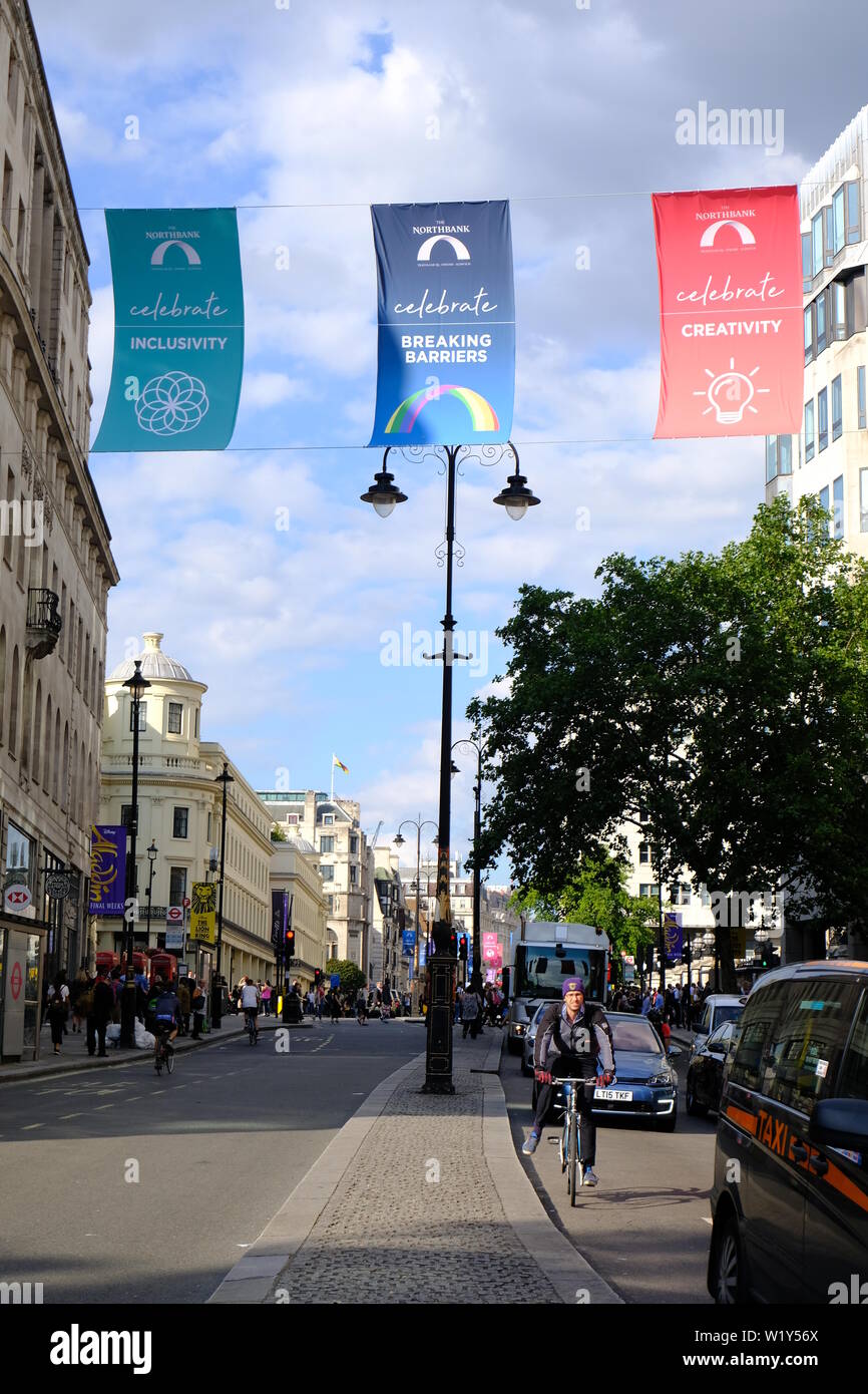 The Strand in London with a display of banners promoting equality in the Northbank during Pride month. Stock Photo