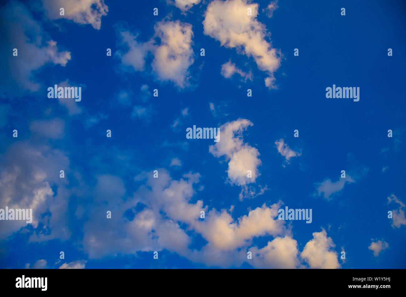 Sky background of colorful clouds at sunset Stock Photo - Alamy