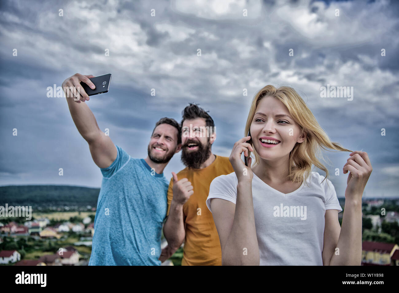 Friends Talking Using Phones Diverse female friends talking using hi-res stock photography and ...