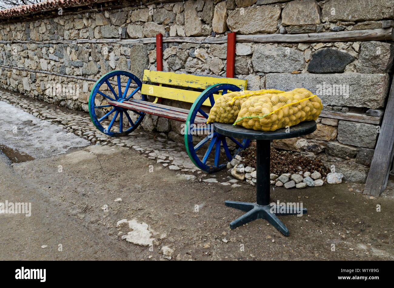 Fresh potatoes in sacks displayed on a street stall for sale, town Koprivshtitsa, Bulgaria, Europe Stock Photo
